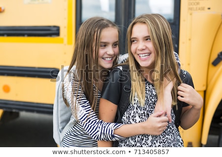 Stock fotó: Portrait Of Two Pre Teenage Girls Studying Outdoors In School Yard