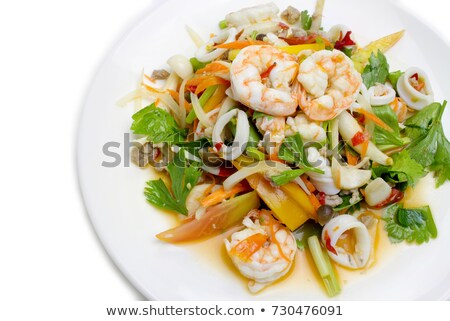 Stok fotoğraf: Delicious Seafood Salad With Vegetables And Shrimps On The Table