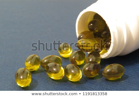 Сток-фото: Bottle With Gelatin Capsules On White