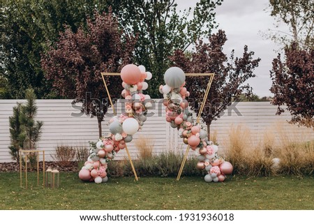 Stock photo: Decoration Wedding Arch With White And Pink Flowers On A Green Natural Background