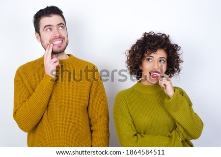 Zdjęcia stock: Portrait Of Romantic Multi Ethnic Couple Standing Near Promenade With Dune On The Background They A