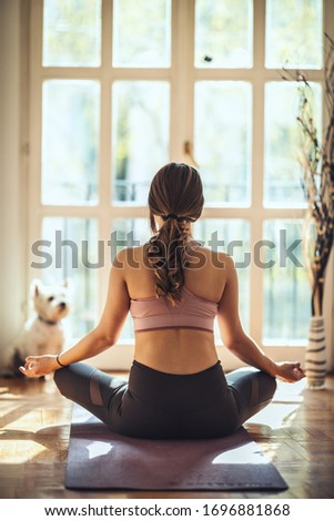 Foto stock: Close Up View Of Woman Doing Morning Yoga At Home In Lotus Position