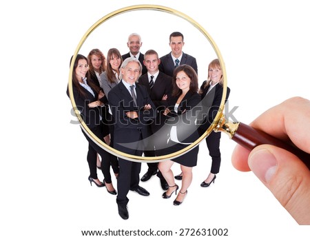 Stock photo: Businessman Looking At A Magnifying Glass Of People Staff Search Hr Concept Vector Isolated Illus