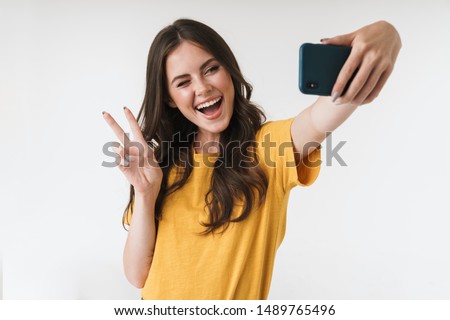 Stockfoto: Photo Of Beautiful Woman 20s Laughing And Taking Selfie On Mobil