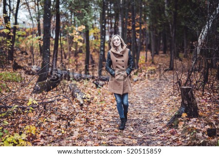 Woman Walking Through The Countryside In Autumn Time ストックフォト © Lopolo