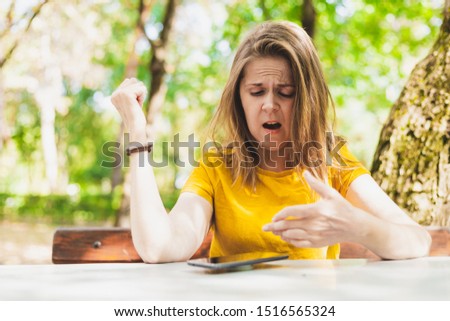 Beautiful Woman Pointing Her Thumb Down While Standing Against A White Background Imagine de stoc © Madrolly