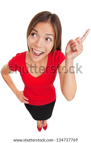 Woman Raising Her Finger In The Air While Looking Up Against A White Background Stock fotó © Ariwasabi