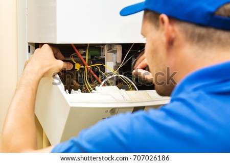 Сток-фото: Maintenance Service Engineer Working With Home Gas Heating Boile