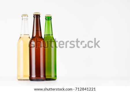 ストックフォト: Beer Bottles 500ml - Brown Green Transparent With Blank White Label On White Wooden Board Mock Up