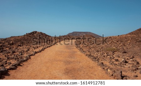 ストックフォト: Road Through Lava Rocks And Volcanic Mountains Los Hervideros