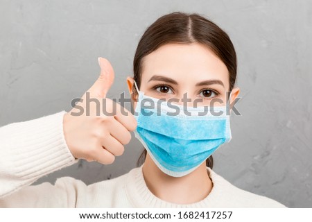 Foto stock: Young Woman In A Medical Mask Because Of An Allergy To Ragweed