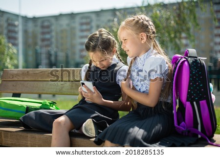 [[stock_photo]]: Close Up Of Cute Caucasian Schoolgirl Sitting On Floor And Reading A Book In Library At Elementary S