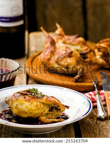Stock fotó: The Baked Quails With Cowberry Sauce
