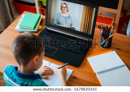 Stock foto: A Teacher A Tutor For Home Schooling And A Teacher At The Table Or Mom And Daughter Homeschooling