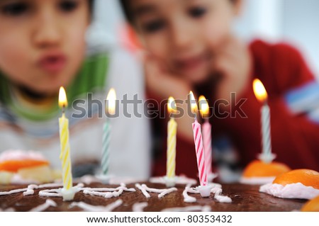 Stok fotoğraf: Time To Blow Out The Candles At A Childs Birthday Party 6 Year Old Boy Blows Out Candles On A Cake