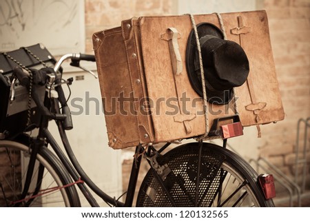 Сток-фото: Shabby Black Hat And Brown Suitcase