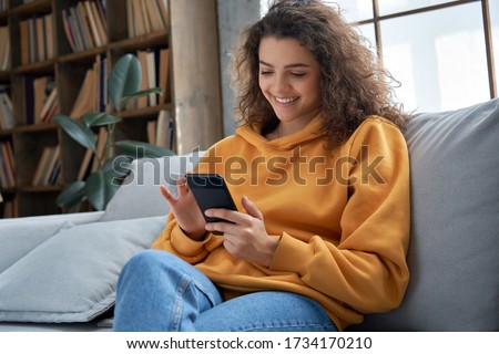 ストックフォト: Happy Adult Woman Smiling With Mobile Phone