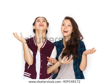 Stock photo: Happy Young Girl Looked Up From The Clothes Hanging On Hangers