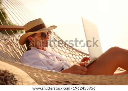 Foto stock: Happy Woman Relaxing Lying On Hammock During Tropical Summer Vacation