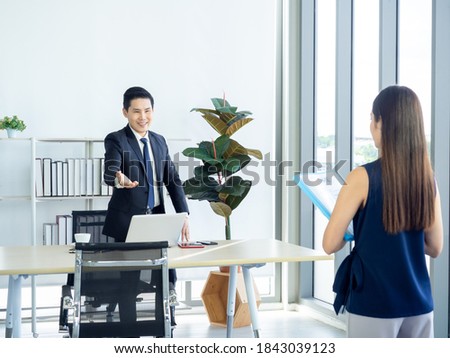 ストックフォト: Happy Businessman Sitting On Chair And Making Welcoming Gesture