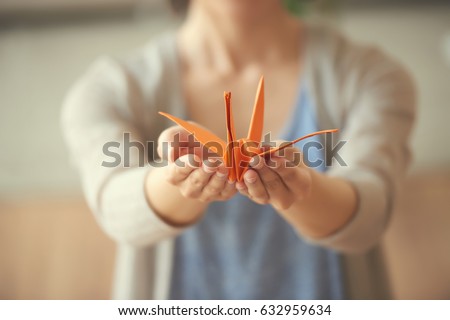 ストックフォト: Female Hands Holding Origami Crane
