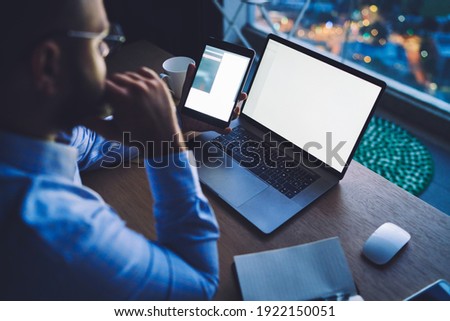Stock fotó: Anonymous Businessmen Browsing Laptop In Office