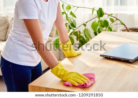 Stock photo: Crop Woman Wiping Out Wooden Table