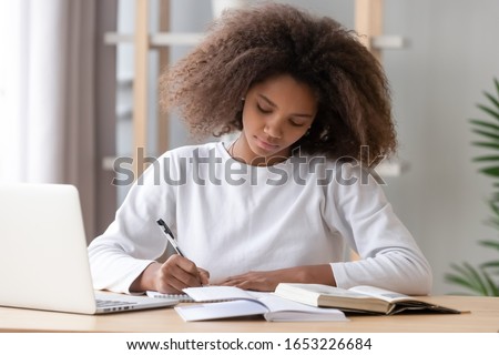Stok fotoğraf: Female Student Working On Project