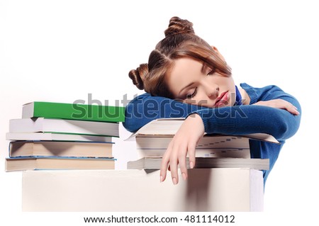 Сток-фото: Tired Girl Sleeping On Books Stack