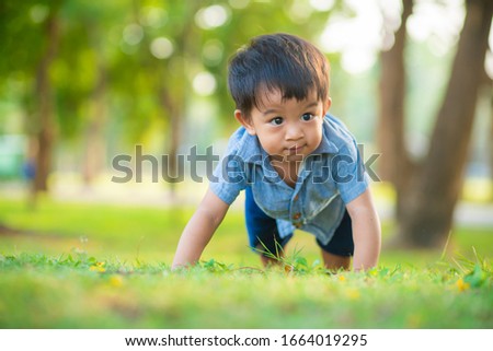 Stock fotó: Happy Little Boy In The Green Park