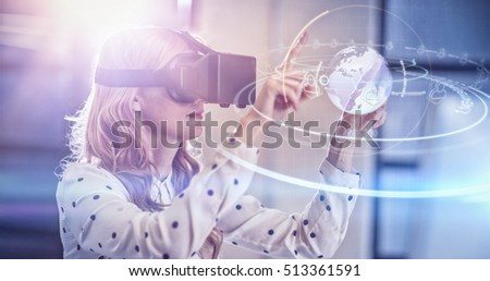 Stock photo: Composite Image Of Woman Using A Virtual Reality Device