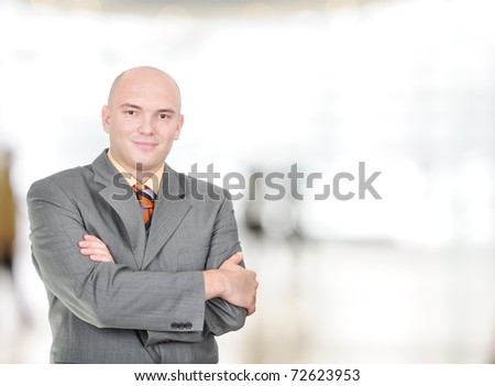 Young Balded Head Businessman With Folded Hands In Bright Workplace Foto stock © Zurijeta