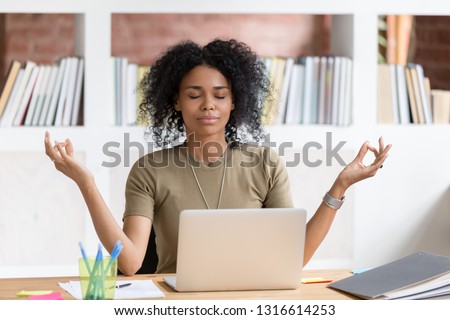 Foto stock: Doing Yoga At Workplace