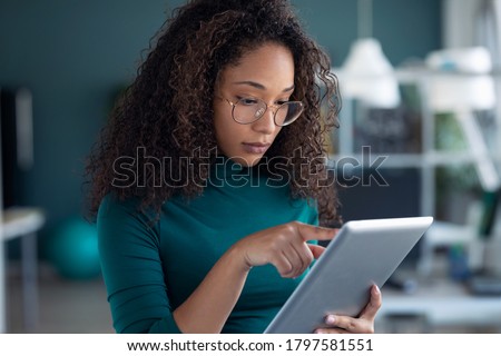 Stock fotó: Woman Using Tablet While Working