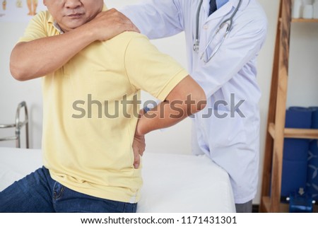Сток-фото: Anonymous Doctor Examining Injured Patient