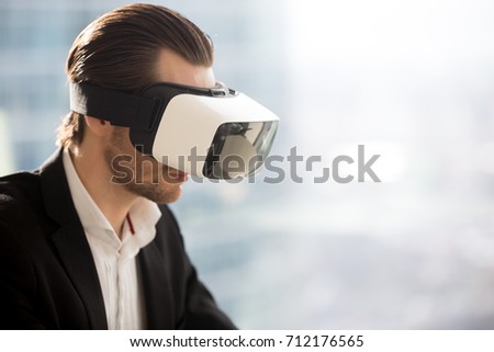 Сток-фото: Businessman Looking Through Virtual Reality Glasses