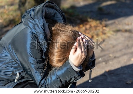 Stock photo: Image Of Displeased Beautiful Woman Grabbing Her Head And Looking Aside