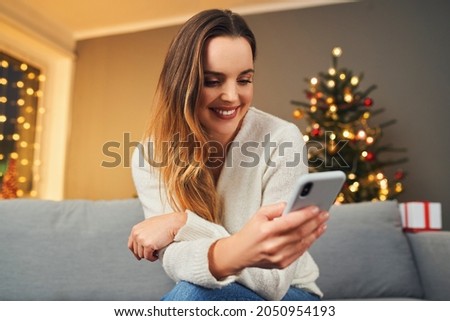 Foto d'archivio: Lonely Woman Browsing Internet On Christmas Eve