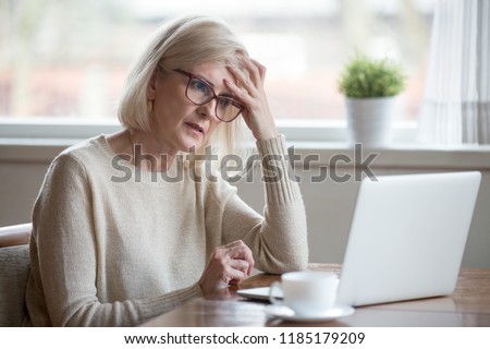 Stock photo: Confused Woman With Laptop