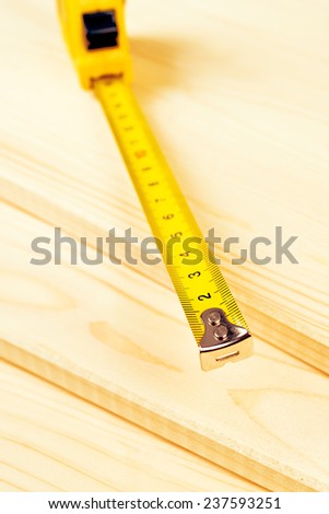 Foto stock: Cartridge Meter And Pine Planks Stacked