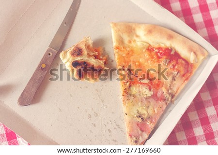 Foto stock: Pizza Leftovers In Cardboard Box Toned Image