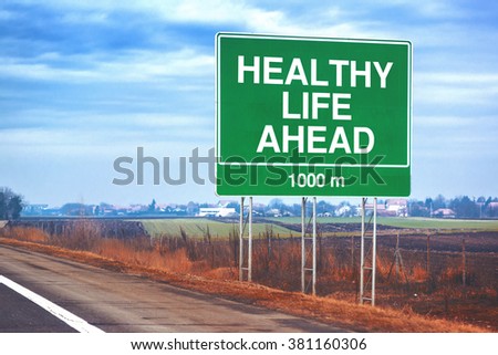 Foto d'archivio: Healthy Life Ahead Traffic Sign At Roadside