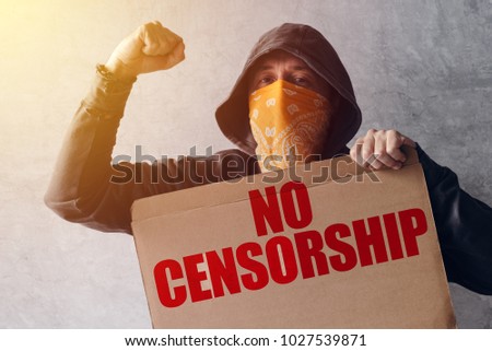 Foto d'archivio: Hooded Activist Protestor Holding No Censorship Protest Sign