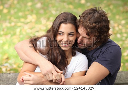 Stockfoto: Portrait Of Love Couple Embracing Outdoor In Park Looking Happy