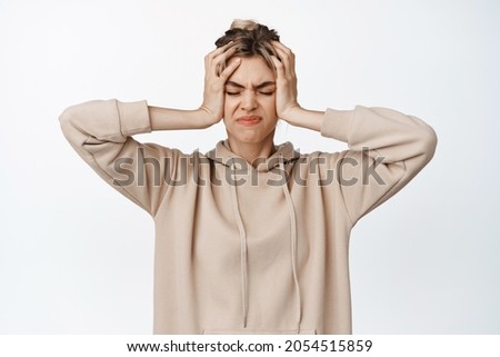 Zdjęcia stock: Attractive Frustrated Female Standing Against A White Background