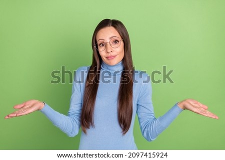 Foto stock: Girl In Green Sweater And Glasses Asking A Question