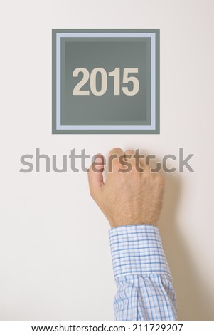 Сток-фото: Businessman Knocking On Door With Number 2015