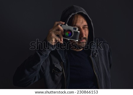 Stockfoto: Adult Bearded Man With Dusty Camera Taking Pictures