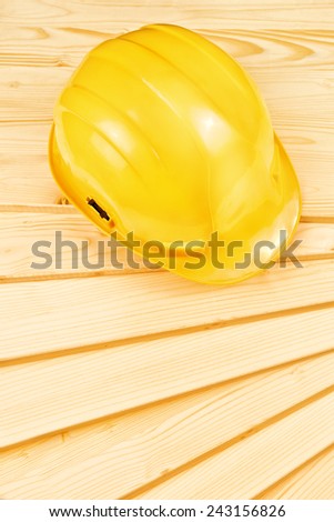 Stock fotó: Yellow Hardhat On Pine Wood Planks