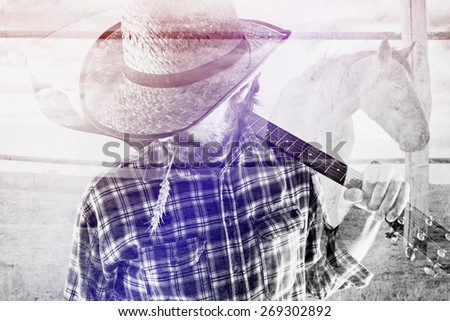 Foto stock: Cowboy Farmer With Guitar And Straw Hat On Horse Ranch